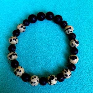 Black lava bead and cow print beaded bracelet